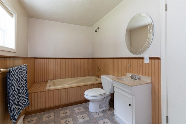 300 Henshaw St, Leicester, MA 01524 - bathroom with a garden tub, wainscoting, vanity, wooden walls, and tile patterned floors