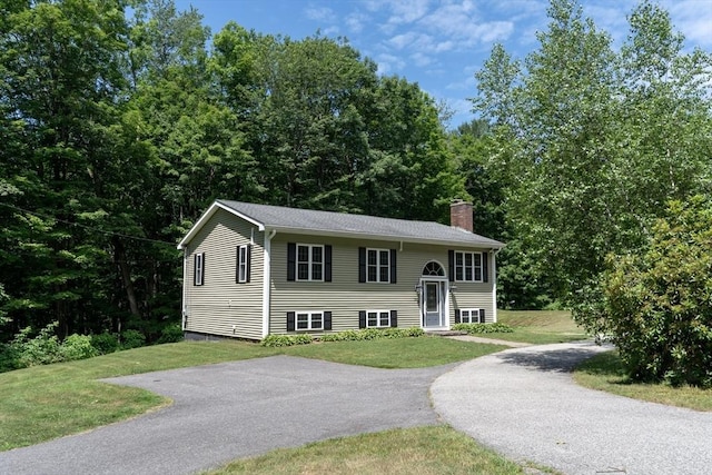 300 Henshaw St, Leicester, MA 01524 - raised ranch featuring a chimney and a front lawn