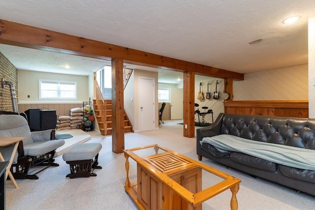 300 Henshaw St, Leicester, MA 01524 - living room with wooden walls, a textured ceiling, stairway, and carpet floors