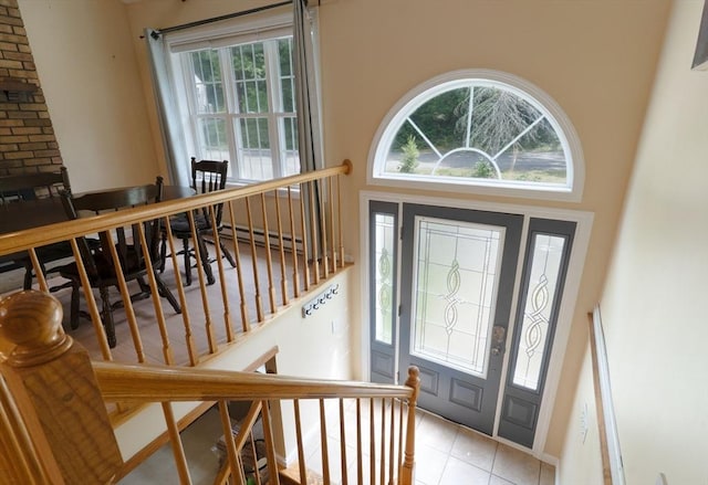 300 Henshaw St, Leicester, MA 01524 - foyer entrance featuring healthy amount of natural light, light tile patterned floors, and stairway