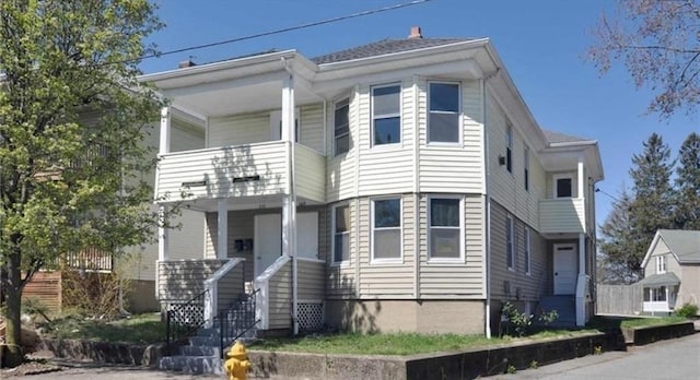 view of front facade with a balcony