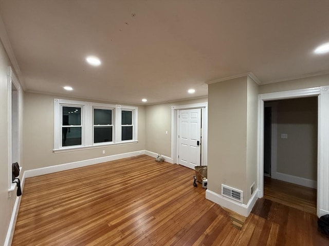 9-11 Elson Rd, Waltham, MA 02451 - foyer with ornamental molding, recessed lighting, and wood finished floors