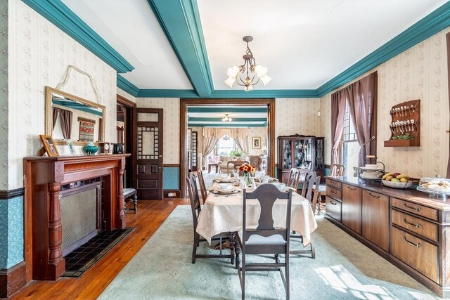 26 S Main St, Belchertown, MA 01007 - dining room featuring crown molding, a chandelier, wood finished floors, wallpapered walls, and beam ceiling