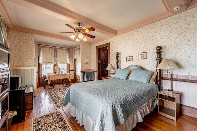 26 S Main St, Belchertown, MA 01007 - bedroom with wallpapered walls, ornamental molding, wainscoting, ceiling fan, and wood-type flooring