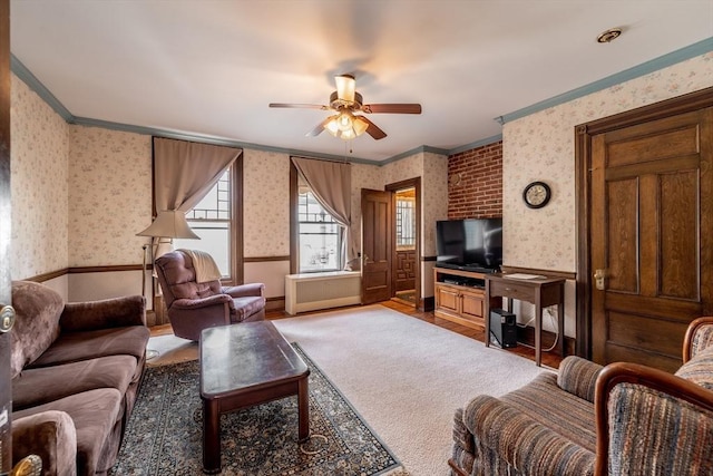 26 S Main St, Belchertown, MA 01007 - living room with crown molding, wallpapered walls, a ceiling fan, and a wainscoted wall