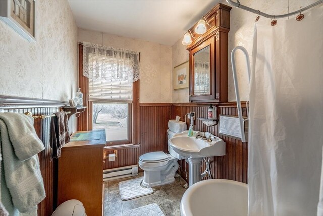 26 S Main St, Belchertown, MA 01007 - full bathroom with a sink, toilet, baseboard heating, wainscoting, and wood walls