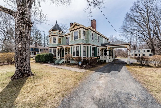 26 S Main St, Belchertown, MA 01007 - victorian house with a carport, driveway, a chimney, and a front lawn