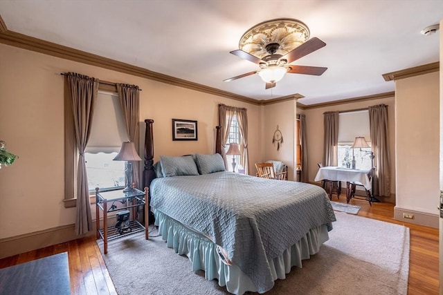 26 S Main St, Belchertown, MA 01007 - bedroom with multiple windows, baseboards, crown molding, and wood finished floors