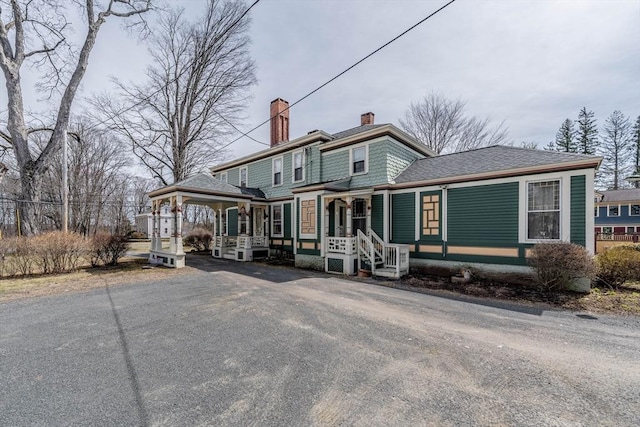 26 S Main St, Belchertown, MA 01007 - view of front of property featuring a porch and a chimney