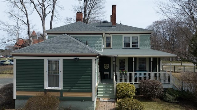 26 S Main St, Belchertown, MA 01007 - view of front of home with a chimney, a shingled roof, and covered porch