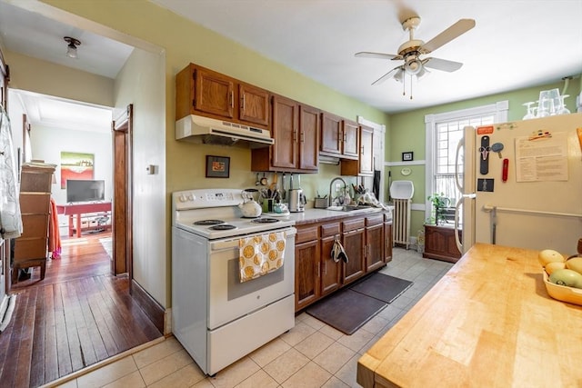 26 S Main St, Belchertown, MA 01007 - kitchen featuring ceiling fan, white appliances, under cabinet range hood, light tile patterned flooring, and a sink