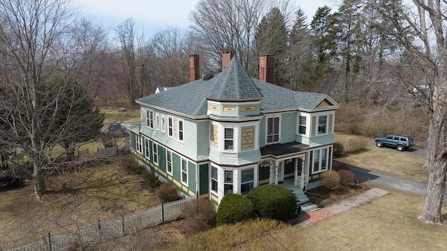 26 S Main St, Belchertown, MA 01007 - exterior space with dirt driveway, fence, roof with shingles, and a chimney