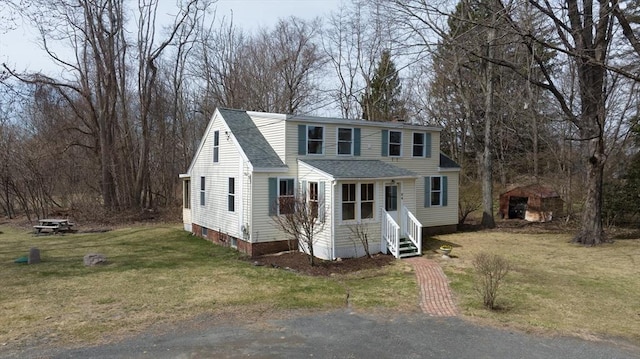 26 S Main St, Belchertown, MA 01007 - view of front of house featuring entry steps, a shingled roof, and a front lawn