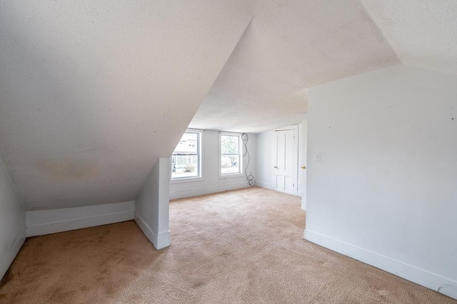 26 S Main St, Belchertown, MA 01007 - bonus room with baseboards, carpet flooring, lofted ceiling, and a textured ceiling