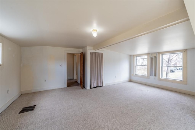 26 S Main St, Belchertown, MA 01007 - interior space with visible vents, light colored carpet, baseboards, and lofted ceiling with beams