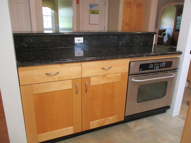 4 Deepwater Ln, Walpole, MA 02091 - kitchen featuring oven, dark stone counters, and arched walkways