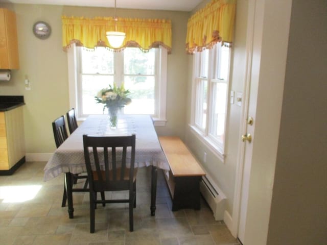4 Deepwater Ln, Walpole, MA 02091 - dining room featuring a baseboard heating unit, light stone finish flooring, and baseboards