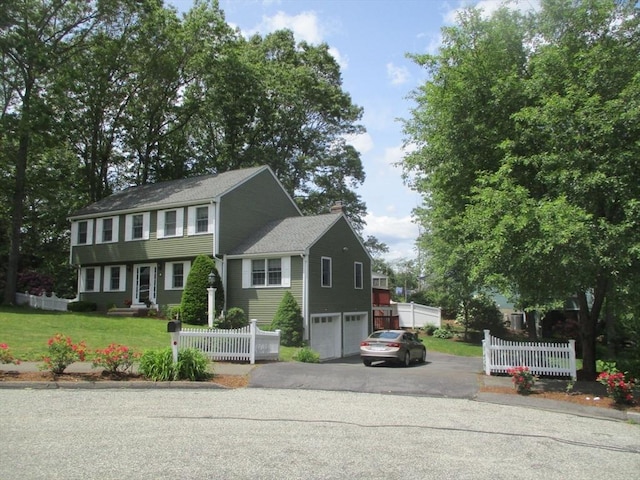 4 Deepwater Ln, Walpole, MA 02091 - view of front of property featuring driveway, an attached garage, and a chimney