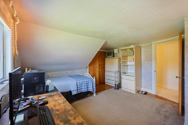 bedroom featuring carpet floors and baseboards