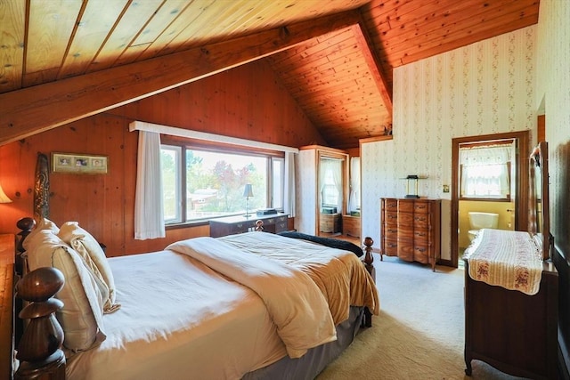 carpeted bedroom featuring vaulted ceiling with beams and wood ceiling