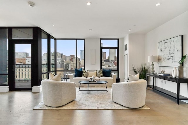 living room featuring hardwood / wood-style flooring and floor to ceiling windows