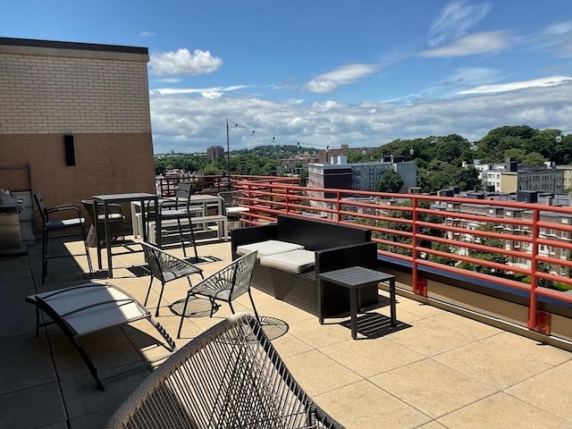 view of patio featuring a balcony and an outdoor hangout area