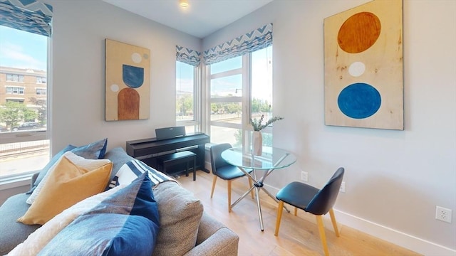 living area with hardwood / wood-style flooring