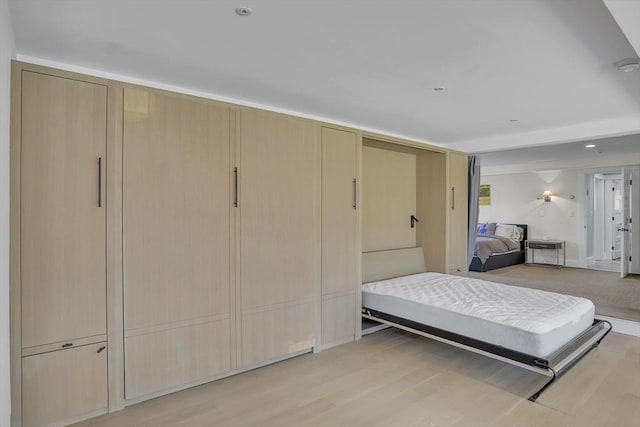 bedroom featuring light wood finished floors