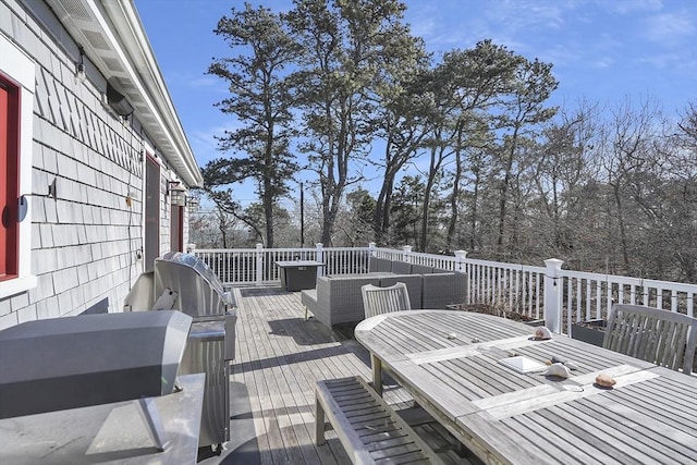 deck featuring outdoor dining area