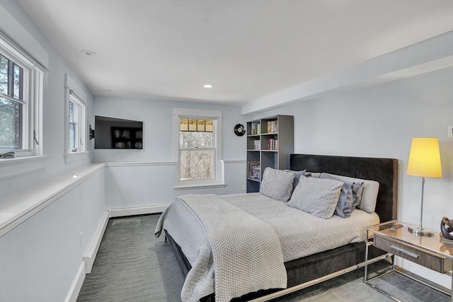 carpeted bedroom featuring baseboards, a baseboard heating unit, and recessed lighting