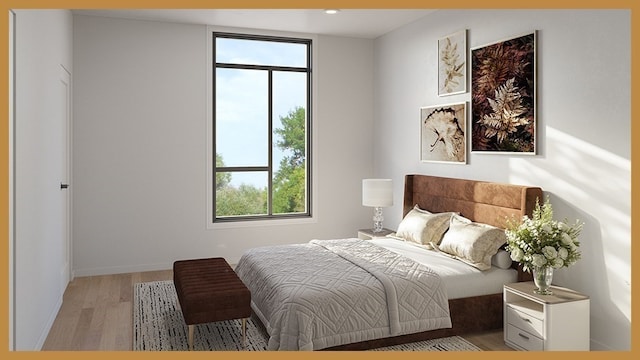 bedroom with multiple windows and light wood-type flooring