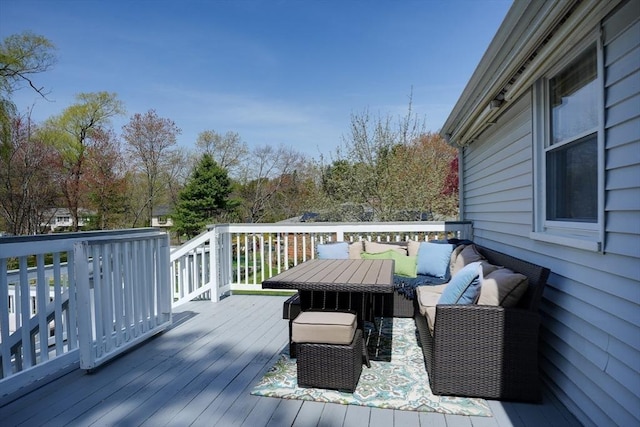 wooden deck with outdoor lounge area