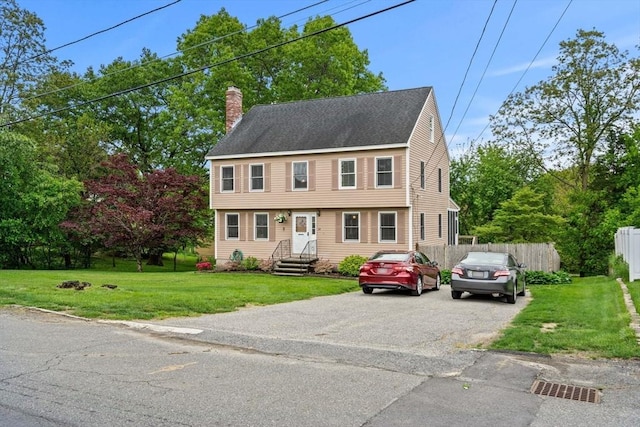 24 Floyd Ave, Tewksbury, MA 01876 - colonial house with a chimney and driveway