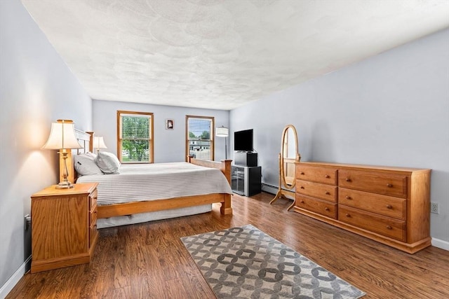 24 Floyd Ave, Tewksbury, MA 01876 - bedroom featuring wood finished floors, a baseboard radiator, and baseboards