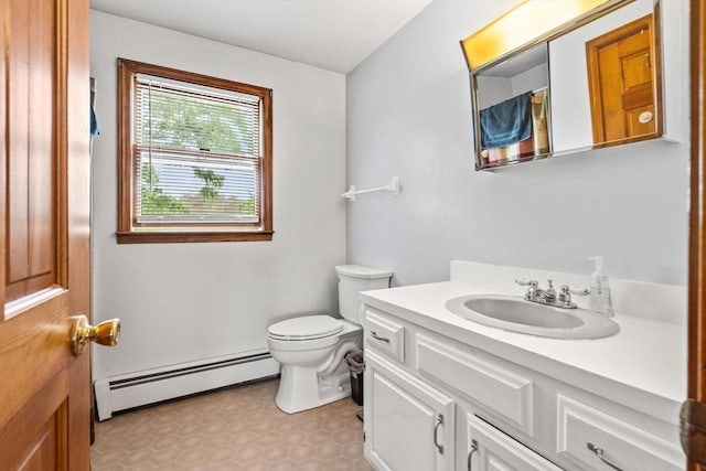 24 Floyd Ave, Tewksbury, MA 01876 - bathroom with a baseboard radiator, vanity, and toilet