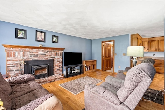 24 Floyd Ave, Tewksbury, MA 01876 - living room with a fireplace and wood finished floors