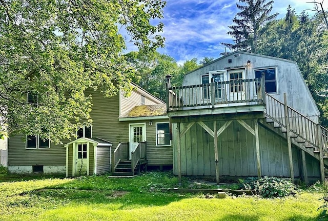 7 Lake Shore Dr, Georgetown, MA 01833 - back of house featuring stairs, a wooden deck, and a yard