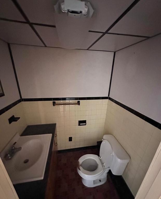 7 Lake Shore Dr, Georgetown, MA 01833 - half bath with tile walls, vanity, and wainscoting