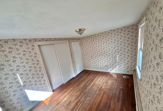7 Lake Shore Dr, Georgetown, MA 01833 - unfurnished bedroom with hardwood / wood-style flooring and wallpapered walls