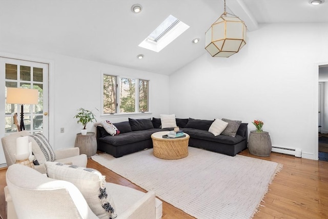 living room with hardwood / wood-style floors, high vaulted ceiling, a baseboard radiator, a skylight, and recessed lighting