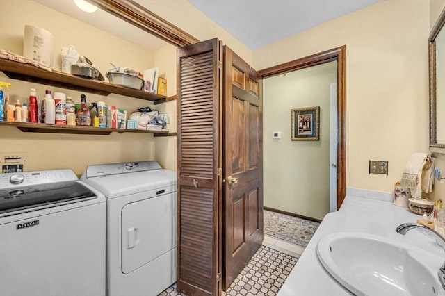 laundry room with sink and washer and clothes dryer