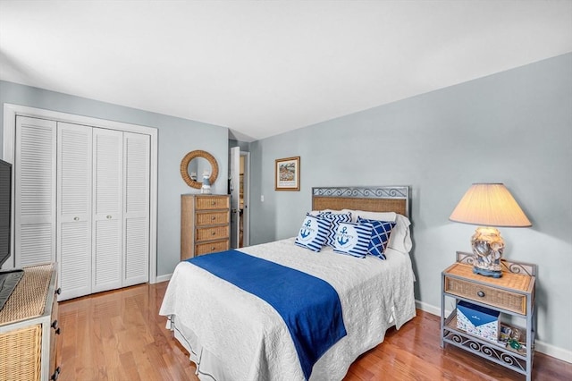 bedroom featuring hardwood / wood-style flooring and a closet