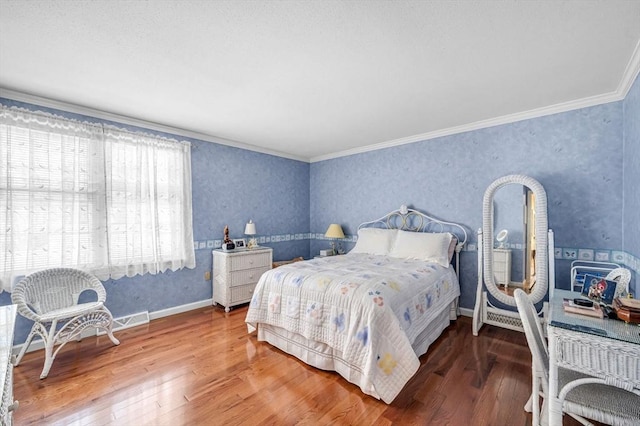 bedroom featuring hardwood / wood-style flooring and ornamental molding