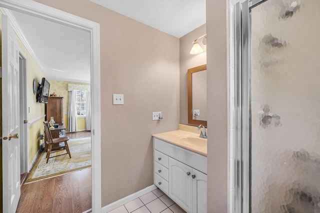 bathroom featuring walk in shower, tile patterned floors, and vanity