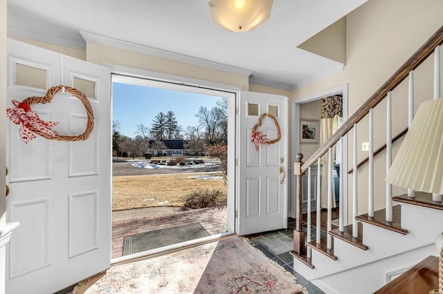 foyer featuring ornamental molding