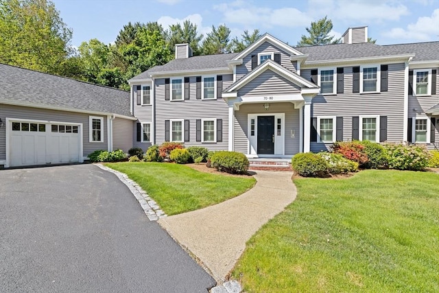 70 Humphreys Ln Unit 70, Duxbury, MA 02332 - colonial inspired home featuring a chimney, a front lawn, driveway, and an attached garage