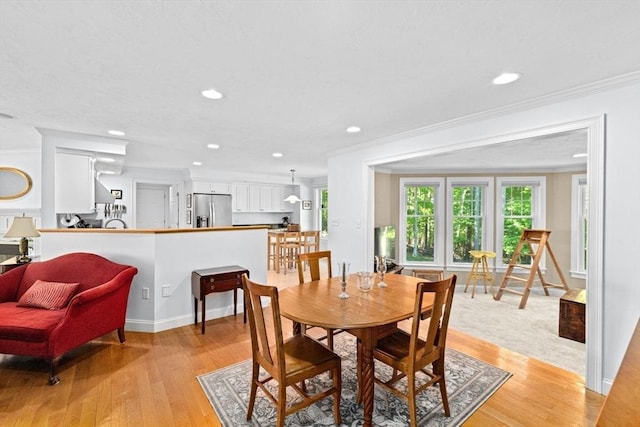 70 Humphreys Ln Unit 70, Duxbury, MA 02332 - dining room featuring healthy amount of natural light, ornamental molding, light wood-type flooring, recessed lighting, and baseboards