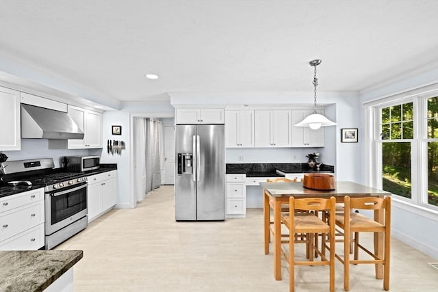 70 Humphreys Ln Unit 70, Duxbury, MA 02332 - kitchen with stainless steel appliances, extractor fan, white cabinets, ornamental molding, and hanging light fixtures