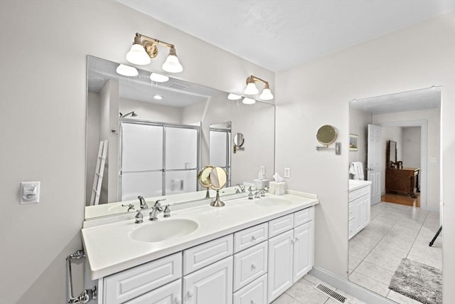 70 Humphreys Ln Unit 70, Duxbury, MA 02332 - full bathroom with double vanity, tile patterned flooring, a shower stall, and baseboards