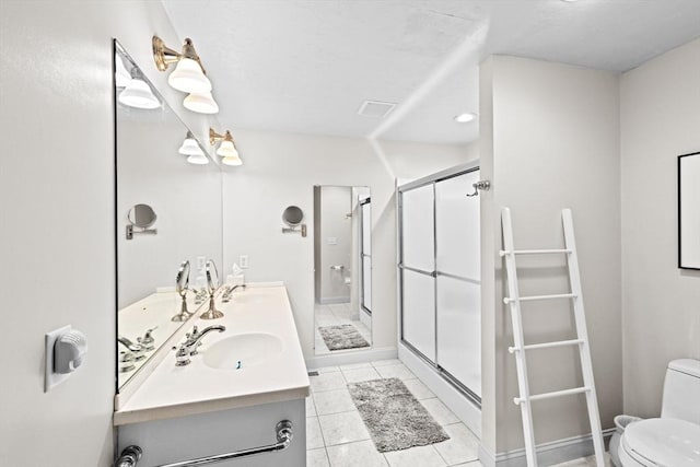 70 Humphreys Ln Unit 70, Duxbury, MA 02332 - full bath featuring toilet, a shower stall, double vanity, and tile patterned flooring